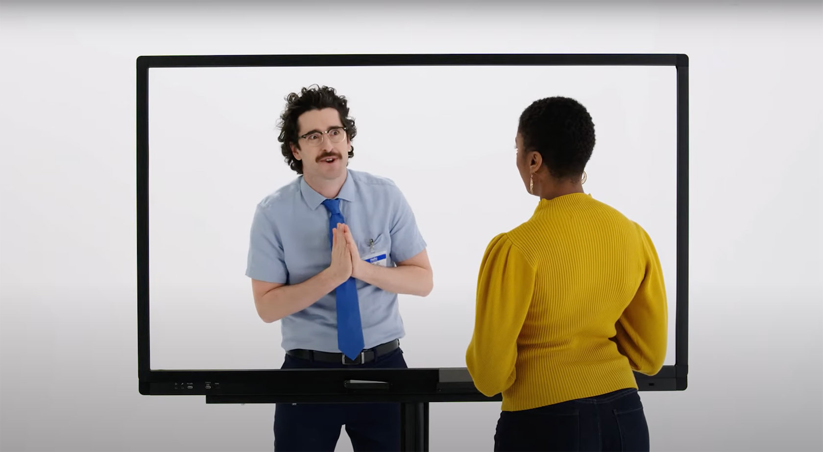 A man and Woman talking through a screen